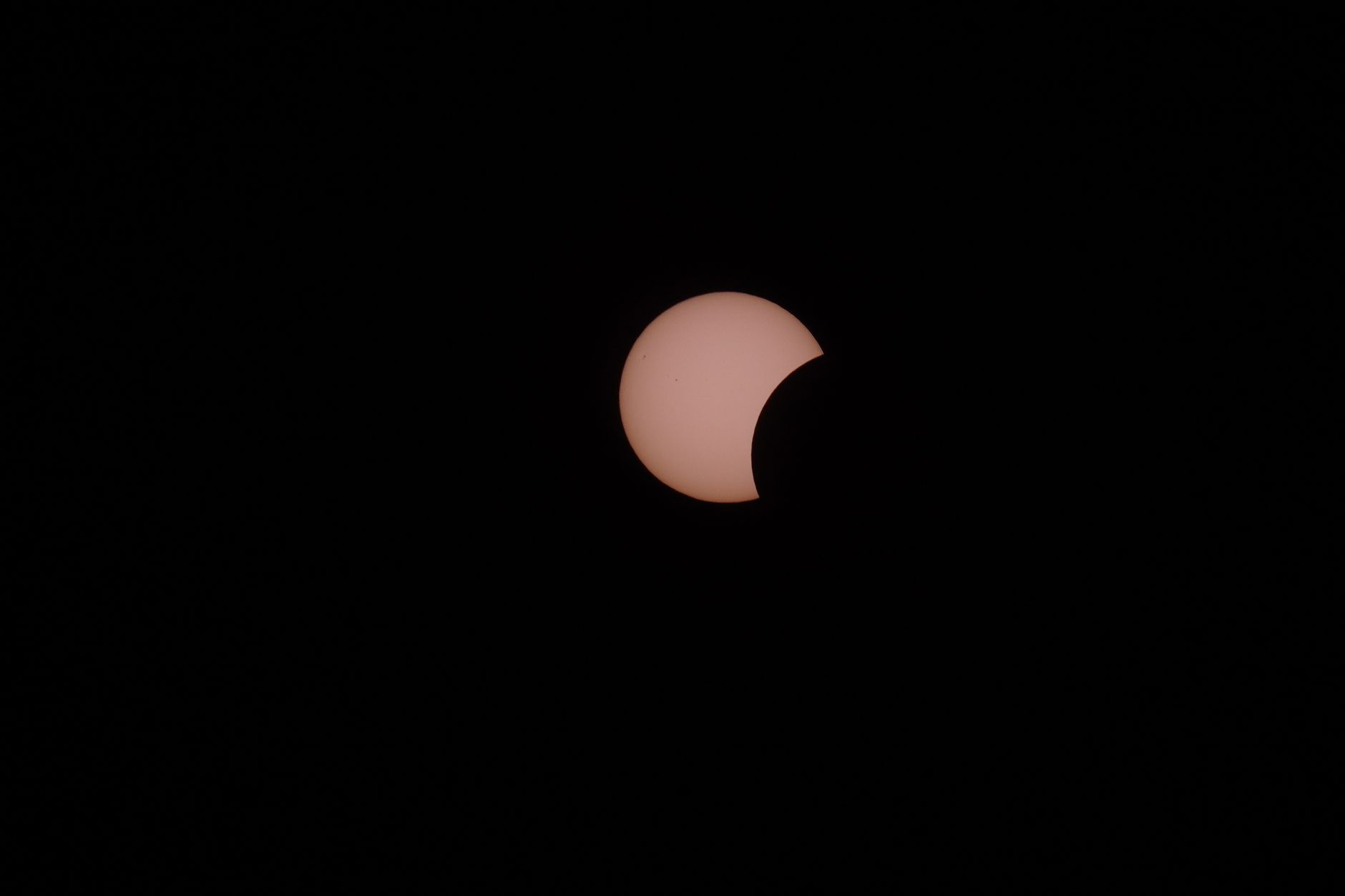 A captivating partial solar eclipse captured against a dark night sky, showcasing celestial wonder.