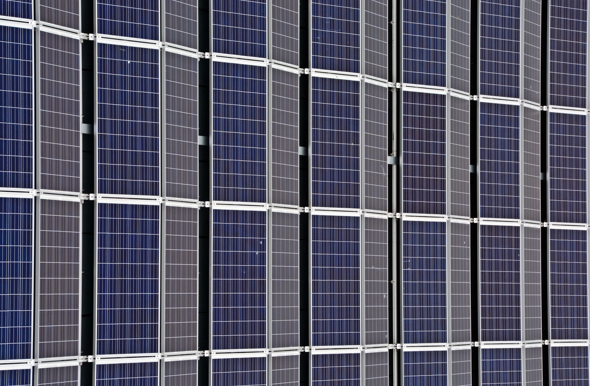 Close-up of multiple solar panels representing renewable energy and sustainability.