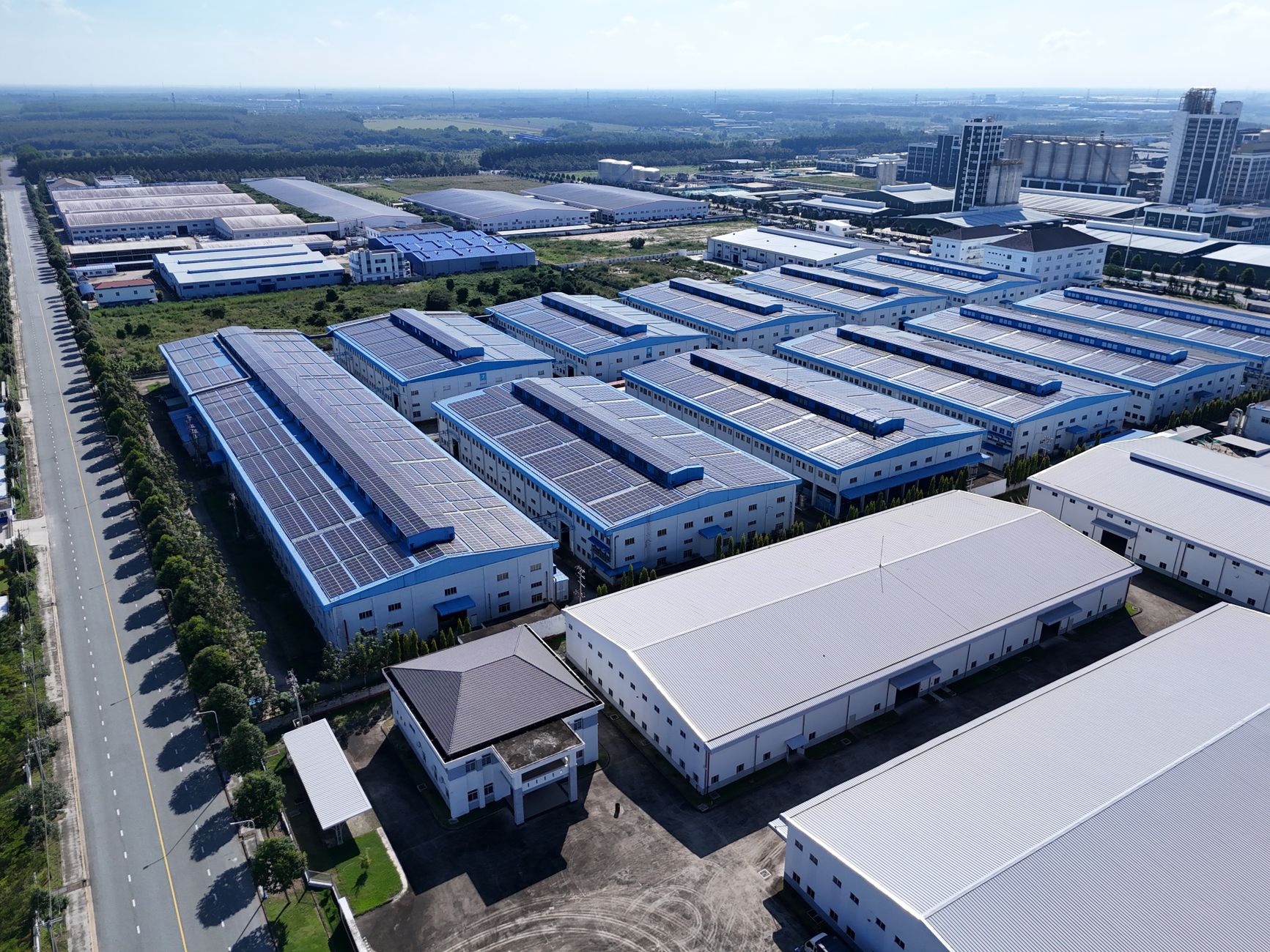 Aerial view of industrial buildings in Thành phố Thủ Dầu Một, Bình Dương, showcasing extensive solar panels.